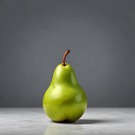 Green pear on a gray background. The concept of healthy eating.の素材