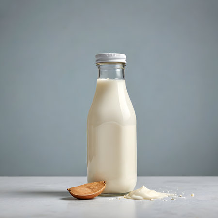 Bottle of milk with almond on gray background, space for textの素材