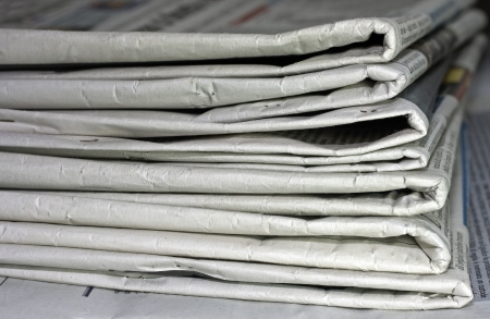 newspapers against plain background shot with very shallow depth of field