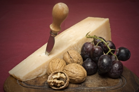 Cheese, nuts and grapesの写真素材