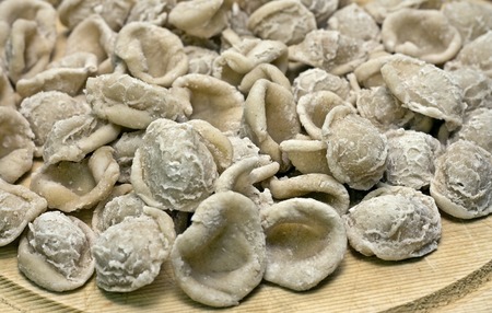 orecchiette pasta raw uncooked in a heapの写真素材