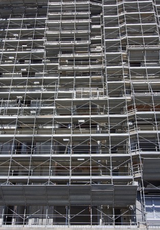 Scaffolding on a construction site of a new buildingの写真素材