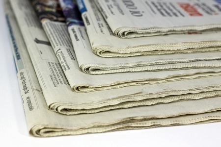 newspapers against plain background shot with very shallow depth of fieldのeditorial素材