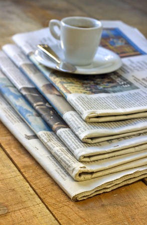 Coffee cup and newspaper - still lifeの写真素材