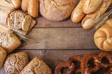 Different breads on wood backgroundの写真素材