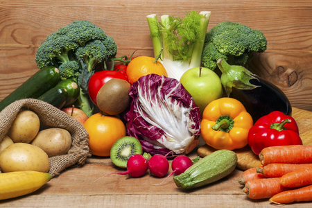 Colorful fruits and vegetables on wood backgroundの写真素材