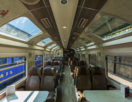Interior with glass ceiling inside Vistadome train. Tourists travelling from Cuzco to Machu Picchu. Rail road between Cuzco and Aguas Calientes, Peruの写真素材