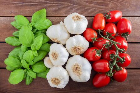 Italian flag from Italian food ingredients: basil, garlic, tomato.の写真素材