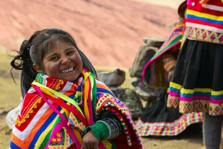Vinicunca - rainbow mountain, PERU - August 31, 2019. Portrait of a female child, wearing typical colored clothesのeditorial素材