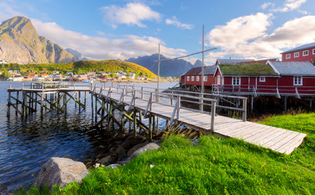 Typical Norwegian fishing village with traditional red rorbu huts, Reine, Lofoten Islands, Norway