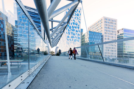 couple walking on Akrobaten pedestrian bridge in Oslo, Norwayの写真素材