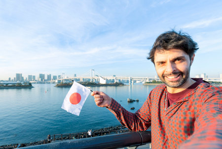 people, travel, tourism, friendship and technology concept - happy tourist taking selfie with...