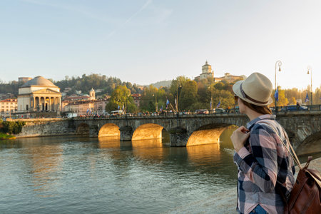 Female tourist enjoying the cityscape of Turin, Italy