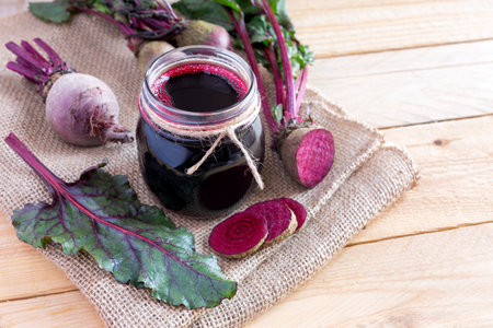 Glass of fresh beetroot juice with vegetablesの写真素材