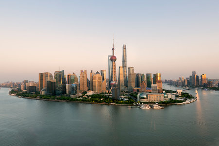 Aerial view of shanghai skyline and winding river at sunriseの写真素材