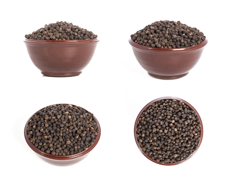 Black pepper isolated on a white background. Pepper in a plate on a white background. Pepper set.の写真素材