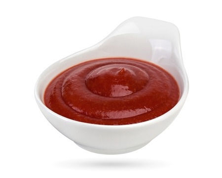Tomato sauce isolated on white background. Bowl of ketchup. With clipping path.の写真素材