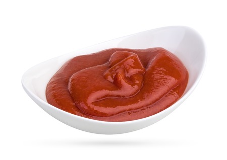tomato sauce in bowl isolated on white background. With clipping path.の写真素材