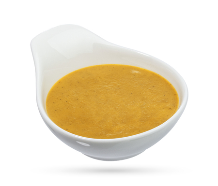 Bowl of mustard on white background. With clipping path.の写真素材
