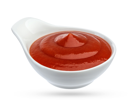 Ketchup in bowl isolated on white background. Portion of tomato sauce. With clipping path.の写真素材