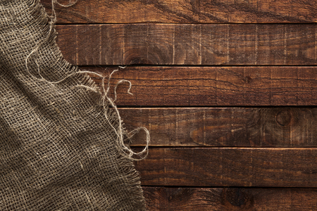 Burlap texture on wooden table background. Wooden table with sackingの写真素材