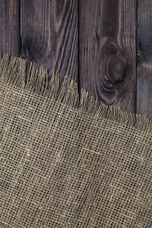 Burlap texture on wooden table background. Wooden table with sackingの写真素材