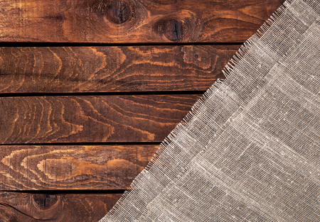 Burlap texture on wooden table background. Wooden table with sackingの写真素材