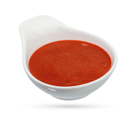 Ketchup in bowl isolated on white background. Portion of tomato sauce. With clipping path.の写真素材