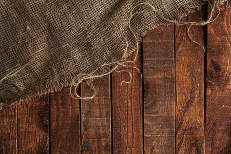 Burlap texture on wooden table background. Wooden table with sackingの写真素材