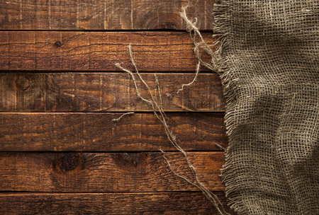 Burlap texture on wooden table background. Wooden table with sackingの写真素材