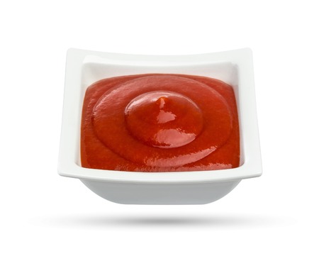 Tomato sauce ketchup in bowl isolated on white background.の写真素材