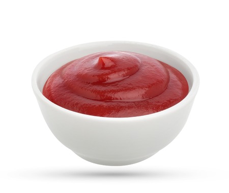 Ketchup in bowl isolated on white background. Portion of tomato sauce. With clipping path.の写真素材