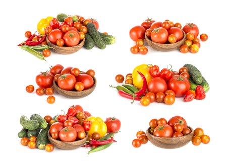 Fresh tomatoes and other vegetables isolated on white backgroundの写真素材