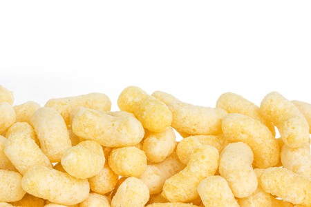 Sweet crunchy corn sticks or snacks backgroundの写真素材