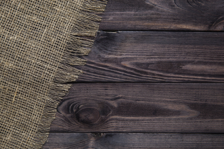 Burlap texture on wooden table background. Wooden table with sackingの写真素材