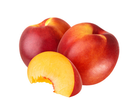 Ripe juicy nectarines isolated on white backgroundの写真素材