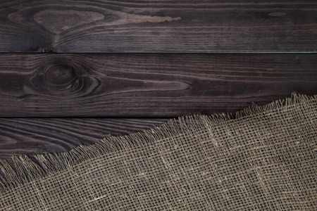 Burlap texture on wooden table background. Wooden table with sackingの写真素材