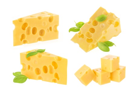 Piece of cheese with basil leaves isolated on whiteの写真素材