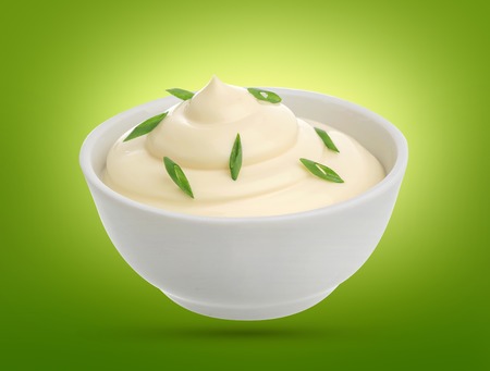 Sour cream with onion in a bowl isolated with clipping path.の写真素材