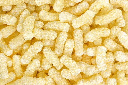 Crunchy corn sticks isolated background or textureの写真素材