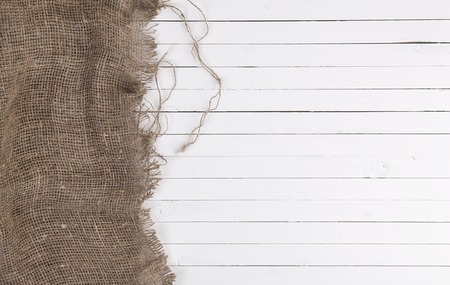 White wooden wall texture or background with burlap, top viewの写真素材