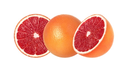 Pink grapefruit and slices isolated on white.の写真素材