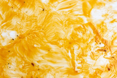 Oil stains background, dirty oven baking tray, greased tray surface with remains of olive oil after roasting food.の写真素材