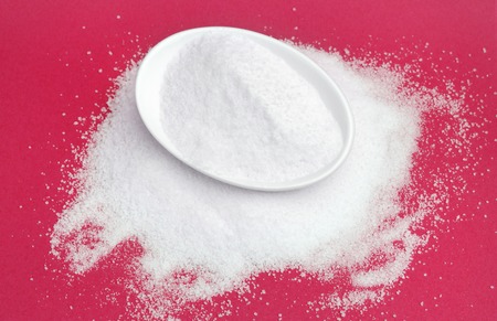Sugar in a bowl isolated, top viewの写真素材