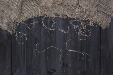 Burlap hessian or sacking on wooden backgroundの写真素材