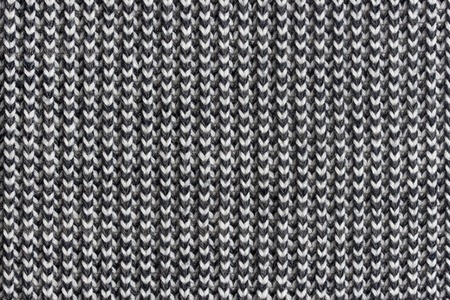 Black and white knitted wool background or textureの写真素材