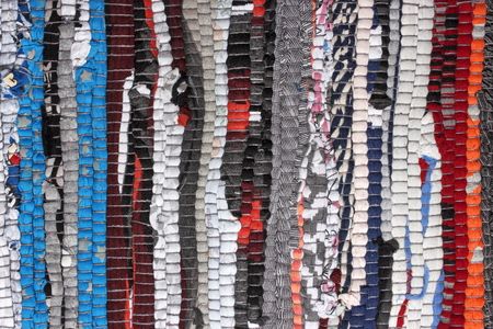 Colorful woven handmade fabric texture motley rug or carpetの写真素材
