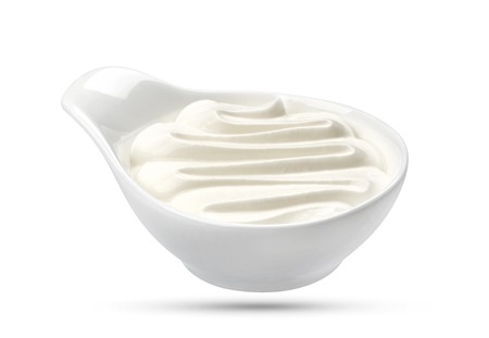 Sour cream in bowl isolated on white background with clipping pathの写真素材