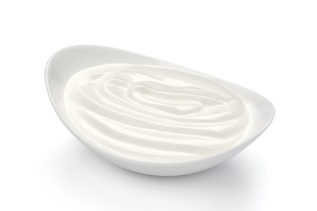 Sour cream in bowl isolated on white background with clipping pathの写真素材