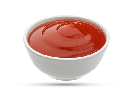 Ketchup in bowl isolated on white background. Portion of tomato sauce. With clipping path.の写真素材